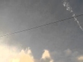 metal UFO orb leaves halo smoke trail