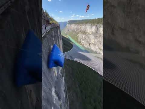 Cliff airbag is wild! 😱🔥 Guy jumps, girl flies! #ScaryRide #TravelWonderGuy