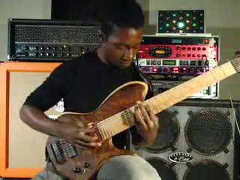 Tosin Abasi playing custom 8 string guitar