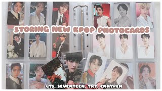 ☁️ organizing + storing new kpop photocards in my binders | bts, seventeen, txt, enhypen