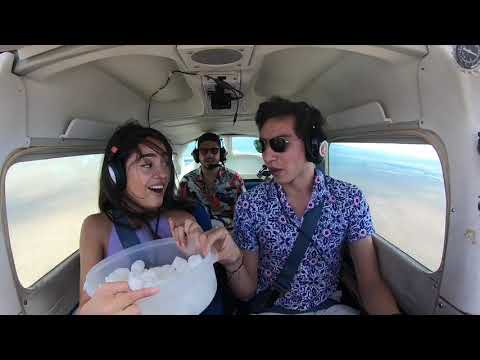 Guy flying scares girl by creating zero gravity.