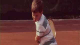 very young Roger Federer playing tennis - he looks very susceptible!!