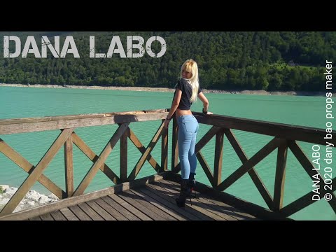 DANA LABO - my super blonde wife walk at lake Bàrcis in blue jeans and shiny boots high heels 17 cm