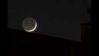 Crescent Moon (5%) Setting over Roof with Chimney