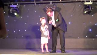 Elliot singing "Blue Sky Sunshine Day" in the "H" Factor