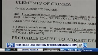 Mother accused of hitting son loses custody of twin