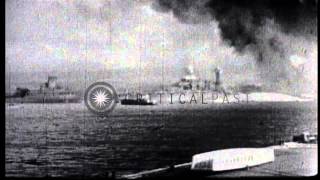Japanese aircraft bomb USS battleships in Hawaii during Pearl Harbor attack. HD Stock Footage