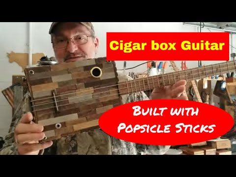 How to build a 3 string Cigar Box Guitar -  Covered in Popsicle sticks - Looks Awesome.
