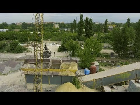 Crane Claw Loading Rubble into Conveyor at Concrete Factory | Stock Footage - Videohive
