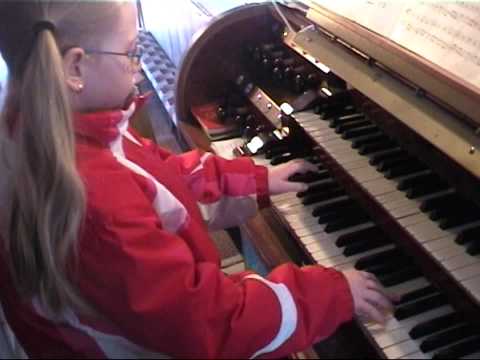 7 years old child plays a real church organ in Bavaria