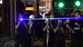 Protesters target laser beams at police officers in Hong Kong