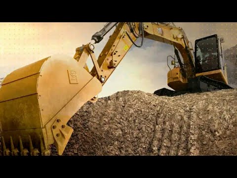 Caterpillar 988F Wheel Loader Loading Komatsu Dumpers With Stones.