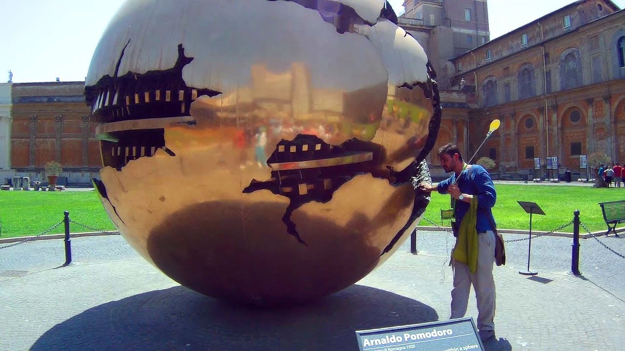 A traveler explores the Vatican Museums nestled in the heart of Rome.