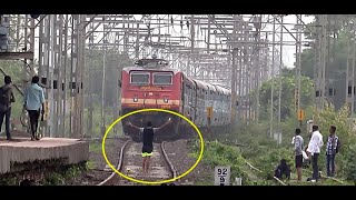 Stupid Guy Giving Titanic Pose, Forcing Terrified Driver To Slow Down The Speeding Express Train