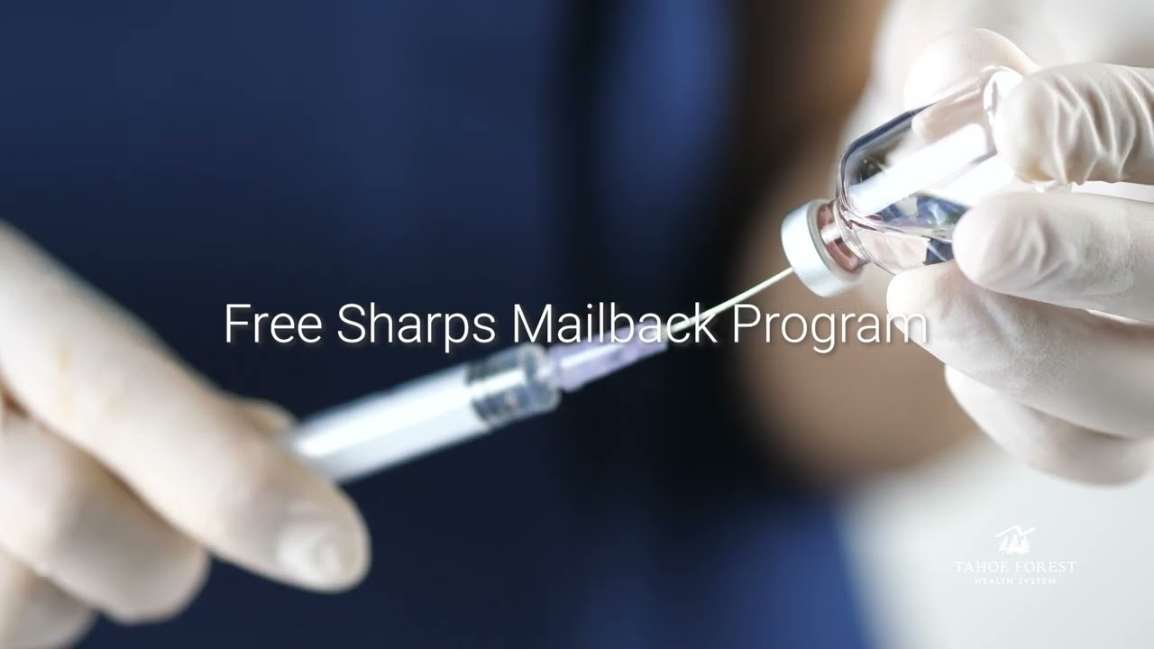 Medical professional holding a needle and medication