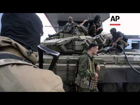 Pro-Russia fighters refuel their tanks