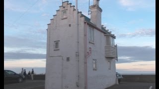 preview picture of video 'Aldeburgh, Suffolk, Small House, middle of car park.'