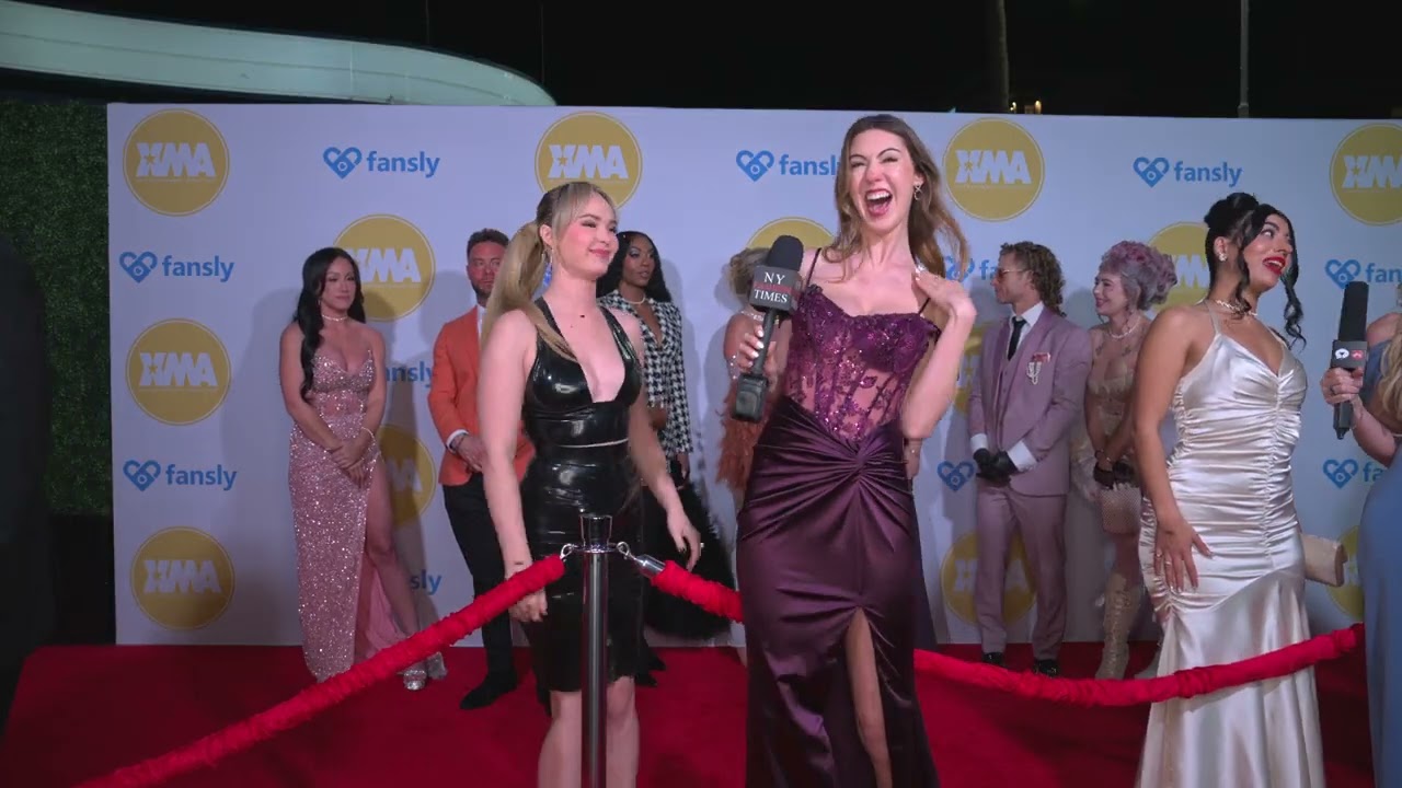 Ellie James poses with Lilly at XMAAwardsLA on the red carpet