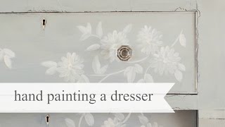 hand painting a dresser