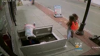 Woman Distracted By Phone Falls Into Sidewalk Hole