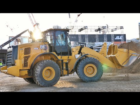 Cat 962M Wheel Loader Filling Trucks with Sand