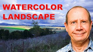 Free full watercolor landscape demonstration. Distant vista, skies, trees, rolling hills, and grass.