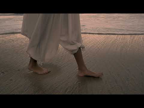 feet walking on the beach