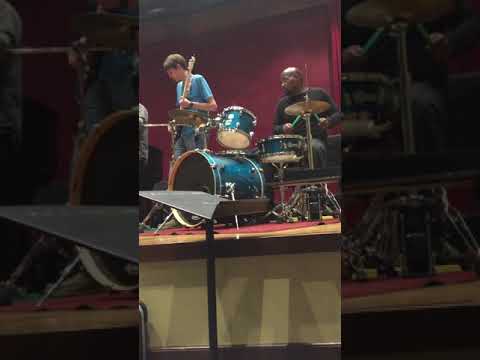 Victor Wooten and Derico Watson with some students