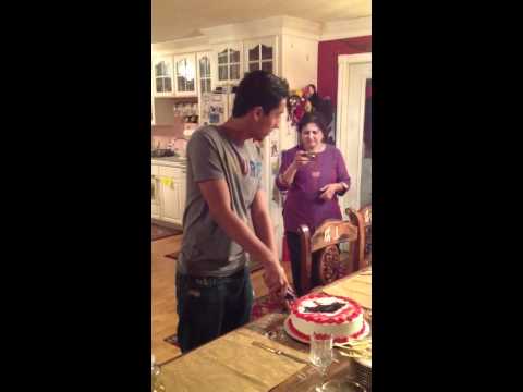 Abdulrahman cutting the graduation cake