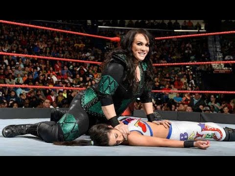 Nia Jax dominating Sasha and Bayley