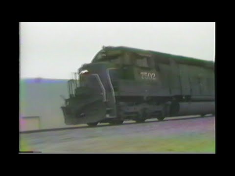 1144. SOUTHERN PACIFIC SP 7502 pacing north of  YARD at Delores California in 1990 with  freight e