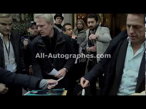 Hugh Grant and Paul King signing autographs in Paris