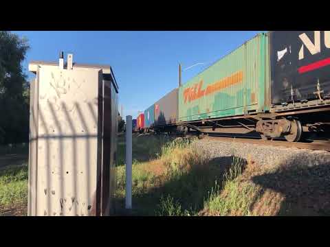 NR111 LDP006 and Metro passing Champion Road Crossing