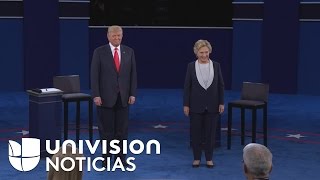 Sin darse la mano los candidatos presidenciales comienzan un debate controversial