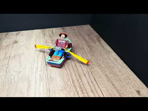 LOT 1095, MET AL WINDUP ROWBOAT TOY