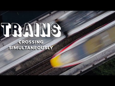 Top Down Drone Perfect Timing: Two Trains Cross River Wear Durham