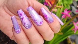 Dreamy floral nails with cat eye and chrome. Purple nail design 