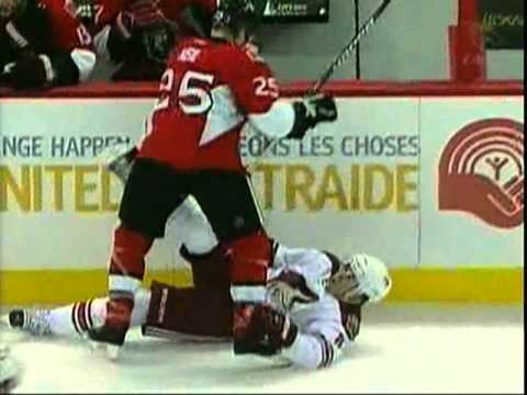 Chris Neil drills Scottie Upshall