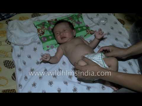 Diaper change time for a sleeping Indian infant 