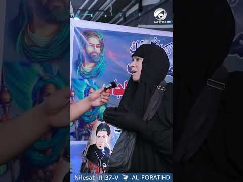 شاهد بالفيديو.. تسير الى كربلاء وتحمل صورة ابنها الشهيد