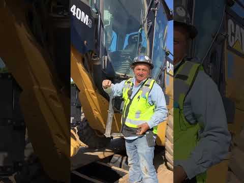 Loading a 140M Grader on a lowboy
