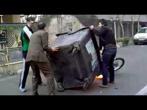 Anti riot motorcycle and dumpster on fire - Iran Tehran 27 Dec  Ashura