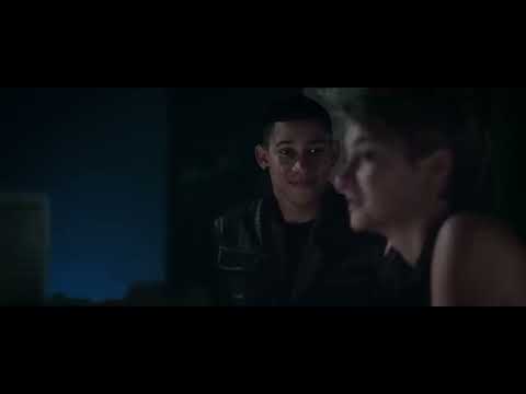 Insurgent trailer frame: Tris leaps through a collapsing glass cube as strings and synth pulses surge