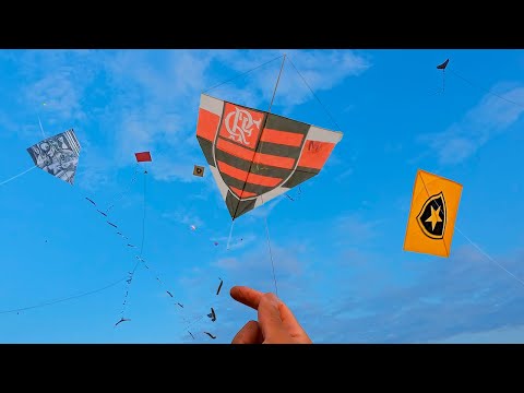 The sky was exploding with kites flying while we were flying a kite!