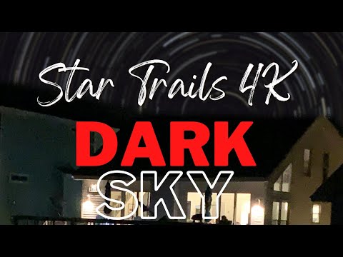 Night sky and star trail video over the coast