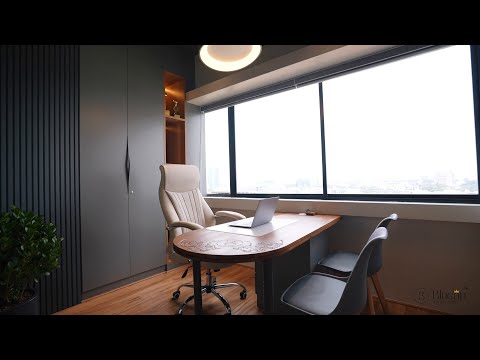 Blucap's own office cabin with carved walnut desk and city view
