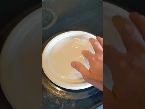Boiling water in paper plate on stove