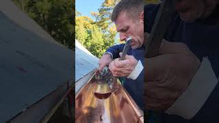 Soldering copper gutters.