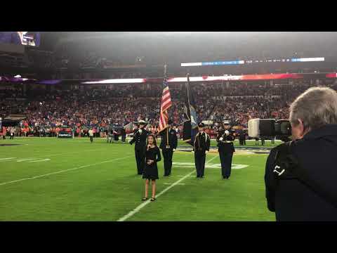 Reina Ozbay (10) sings the National Anthem at the 2019 Orange Bowl