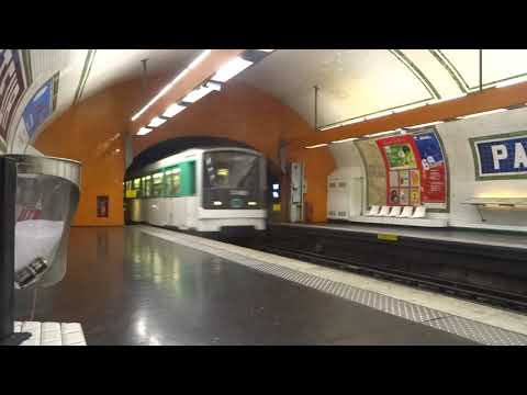Paris Metro Line M12 train arriving at Pasteur